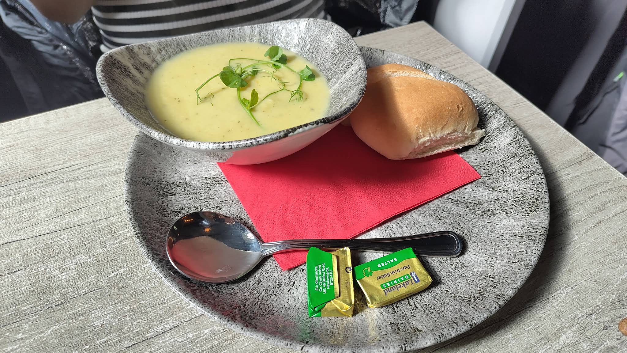 A complete plate at Harley’s with a bowl of soup, bread, butter and a spoon